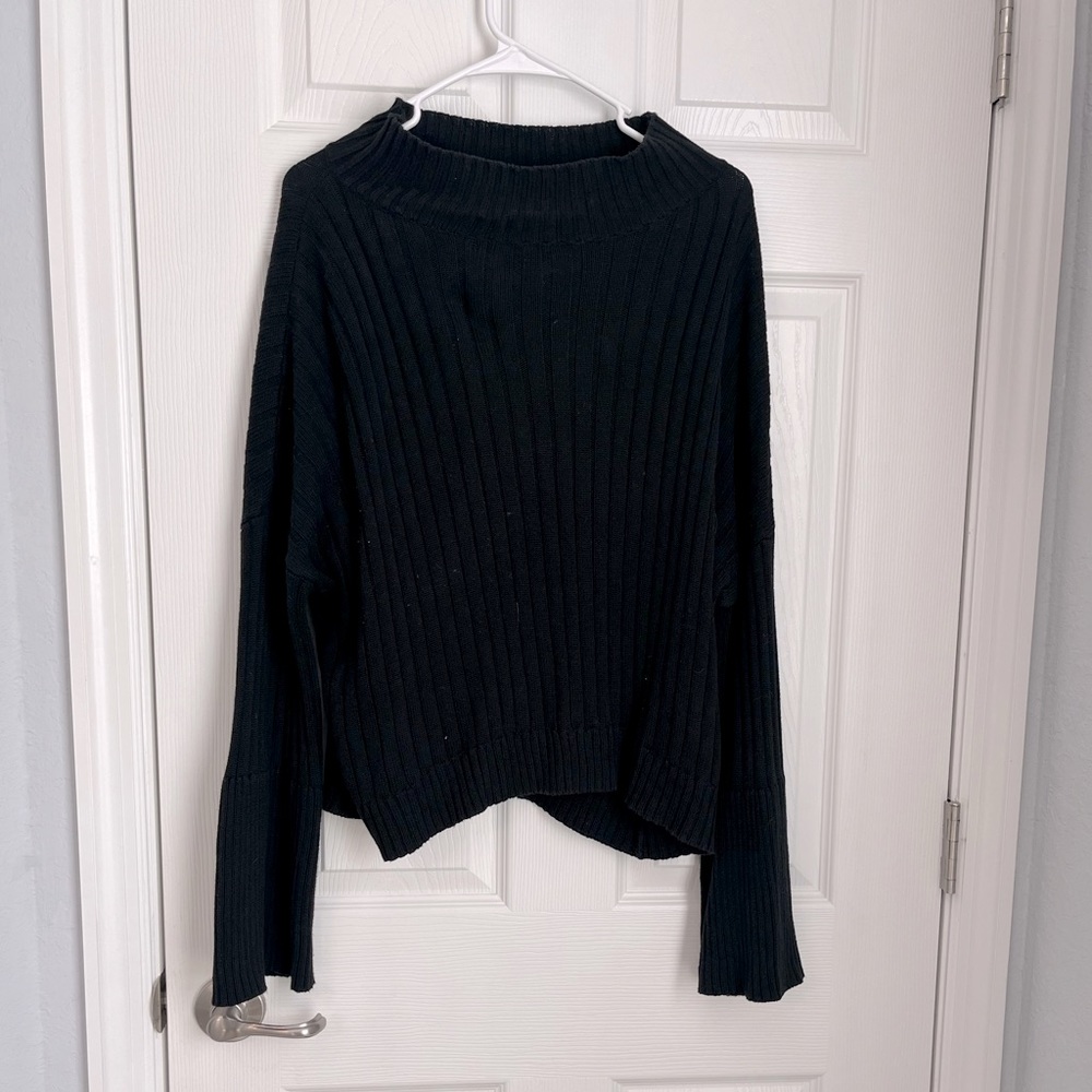 Lose fitted comfy sweater with bell sleeves and cowl neck